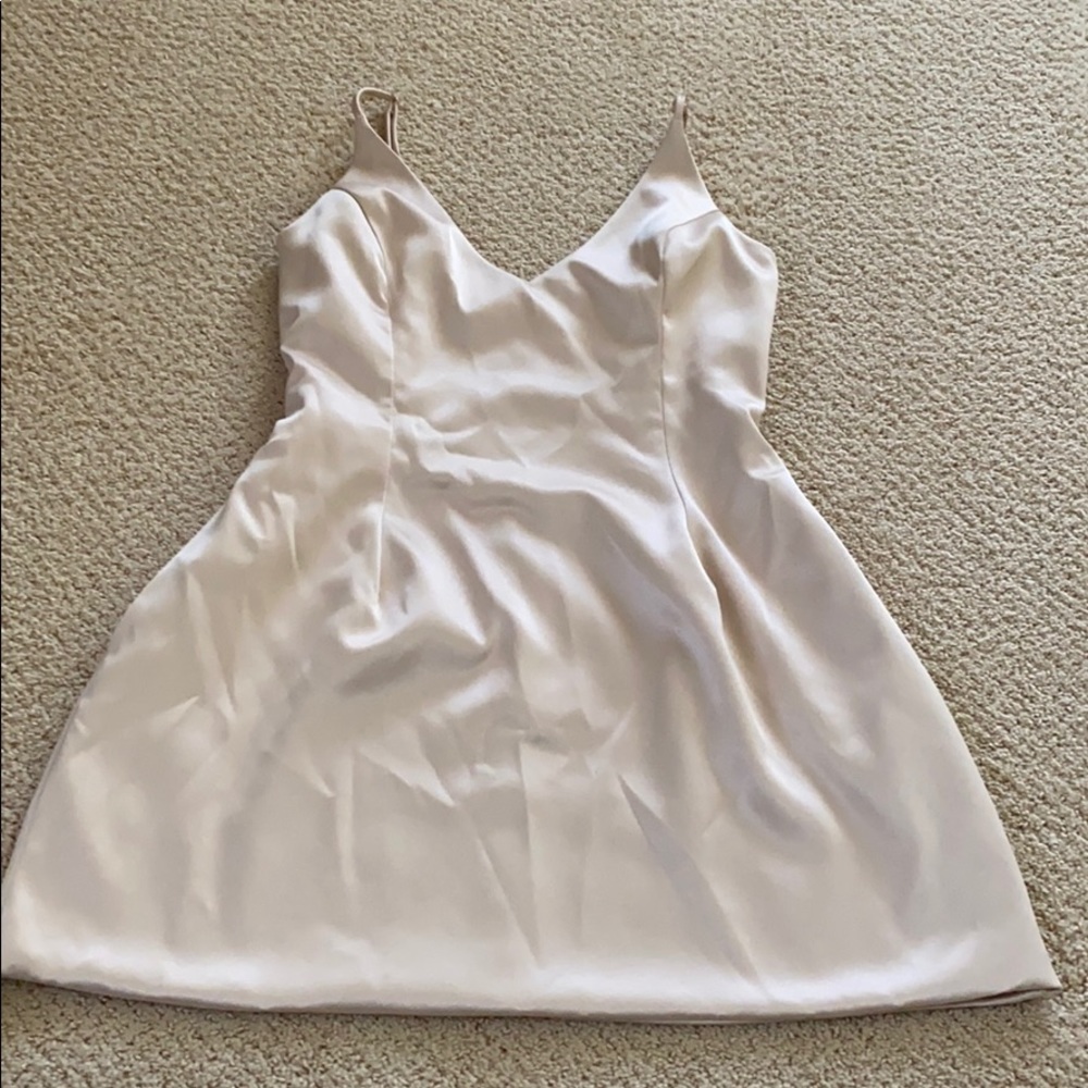 Laura’s boutique light tan dress